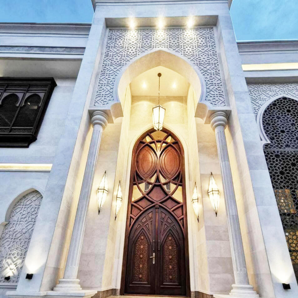 Moroccan-Style Limestone Facade Private Villa · UAE · 2018 Full exterior stone facade in hand-cut limestone, columns, arches, and ornamental latticework.