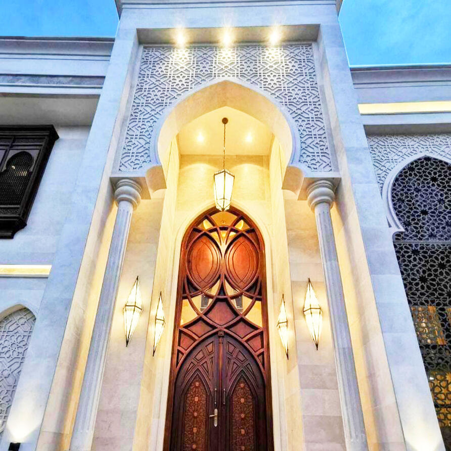 Moroccan-Style Limestone Facade Private Villa · UAE · 2018 Full exterior stone facade in hand-cut limestone, columns, arches, and ornamental latticework.